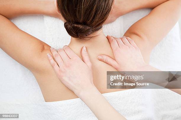 woman having a massage - massage table white background stock pictures, royalty-free photos & images