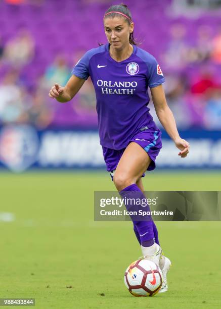 Orlando Pride forward Alex Morgan shoots the ball during the NWSL soccer match between the Orlando Pride and the North Carolina Courage on June 30th,...