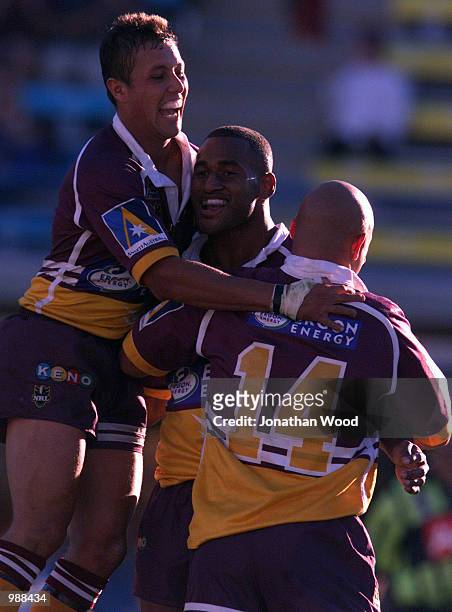 Lote Tuqiri, Scott Prince and Corey Parker of the Broncos celebrate a try during the round fourteen NRL match between the Brisbane Broncos and the...