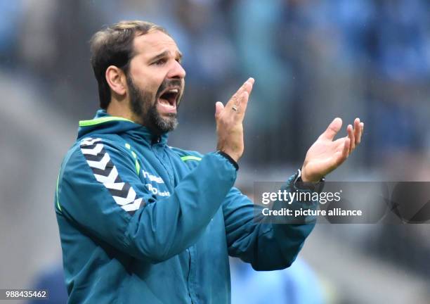 File picture dated 08 April 2016 showing Greuther Furth's then-head coach, Stefan Ruthenbeck, clapping on the sidelines of the 2nd Bundesliga soccer...