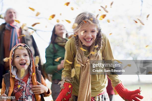 family laughing outdoors - autumn family stock pictures, royalty-free photos & images