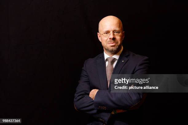 Andreas Kalbitz, member of the federal board of the Alternative for Germany , stands in a mobile photo studio in the course of the AfD's party...