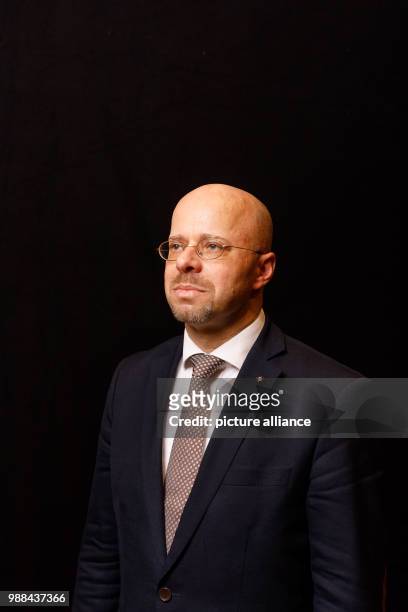 Andreas Kalbitz, member of the federal board of the Alternative for Germany , stands in a mobile photo studio in the course of the AfD's party...