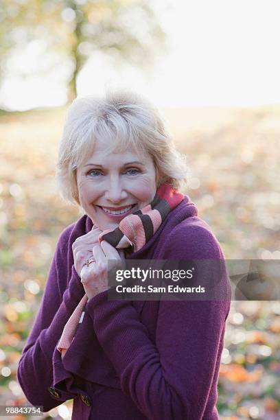 smiling woman outdoors in autumn - people shivering stock pictures, royalty-free photos & images