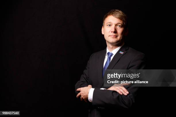 Andre Poggenburg, state chairman of the Alternative for Germany Saxony-Anhalt, stands in a mobile photo studio in the course of the AfD's party...