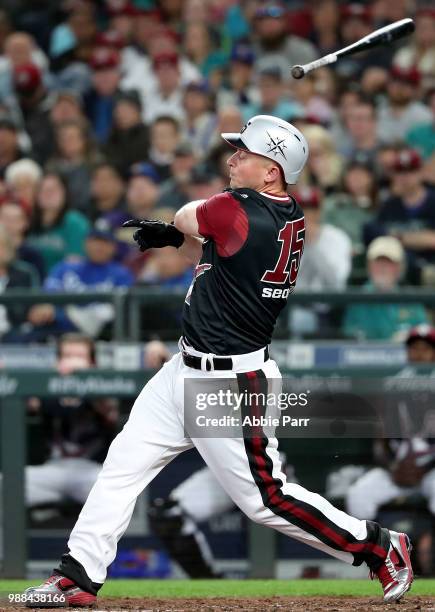 Kyle Seager loses his bat while batting in the first inning against the Kansas City Royals during their game at Safeco Field on June 30, 2018 in...