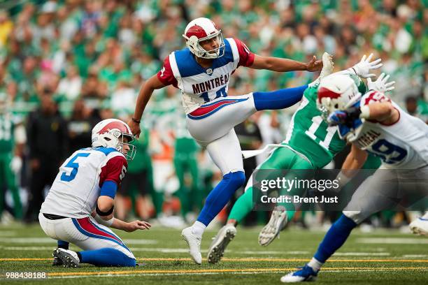 Boris Bede of the Montreal Alouettes watches the ball sail through the uprights for a field goal in the first half of the game between the Montreal...