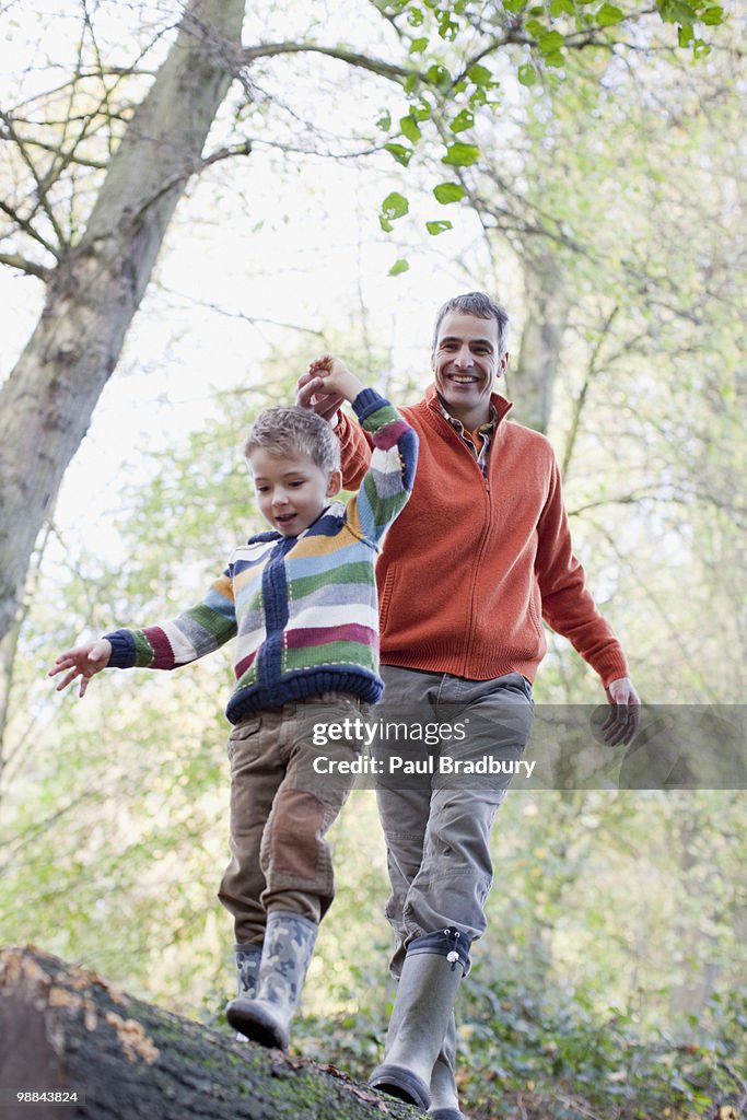 Father Log Father Helping Son Cross Log Outdoors High-Res Stock Photo - Getty Images