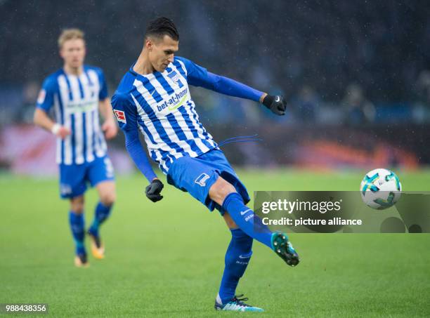 Hertha Berlin's Davie Selke passes the ball on during the German Bundesliga football match against Eintracht Frankfurt at the Olympiastadion in...