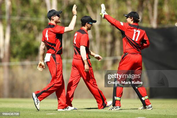 Cameron Bancroft of the Desert Blaze celebrates with Daniel Mylius of the Desert Blaze after taking a catch in the outfield during the Strike League...