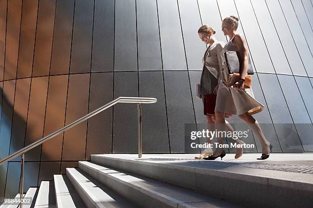 businesswomen walking down steps outdoors - walk to work woman bildbanksfoton och bilder