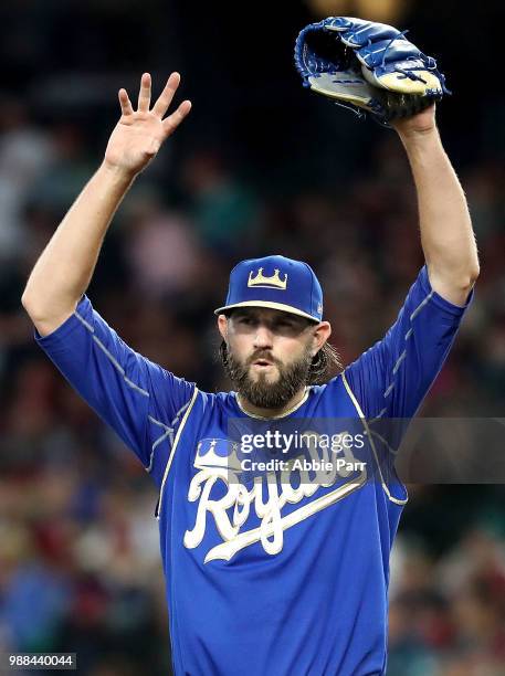 Jason Hammel of the Kansas City Royals reacts after giving up a two run home run to Ryon Healy of the Seattle Mariners in the second inning during...