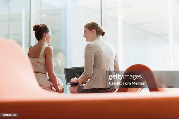 businesswomen working in waiting area - business meting stock pictures, royalty-free photos & images