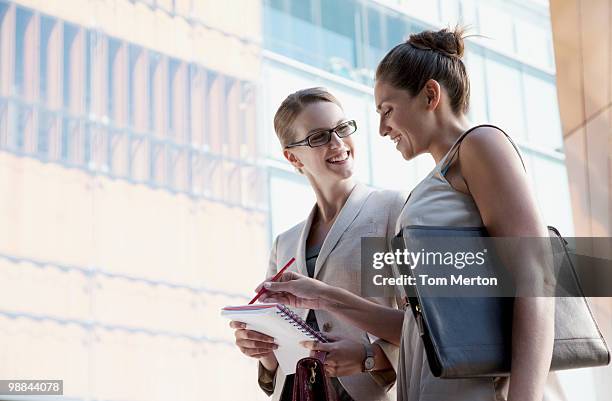 businesswomen talking outdoors - sydney buildings city stock pictures, royalty-free photos & images