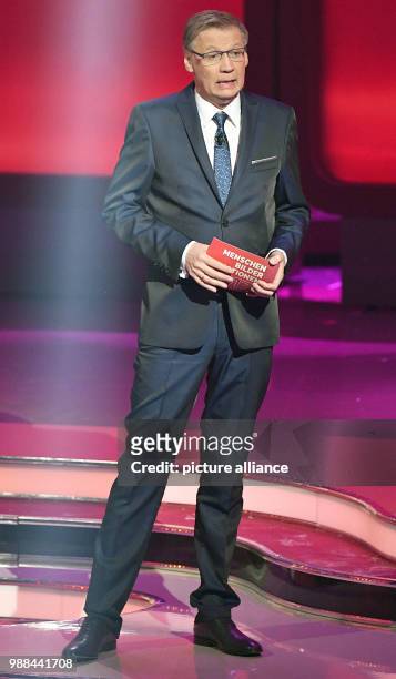 Host Guenther Jauch stands on stage during the recording of the RTL broadcasting end-of-the-year review TV show '2017! Menschen, Bilder, Emotionen'...