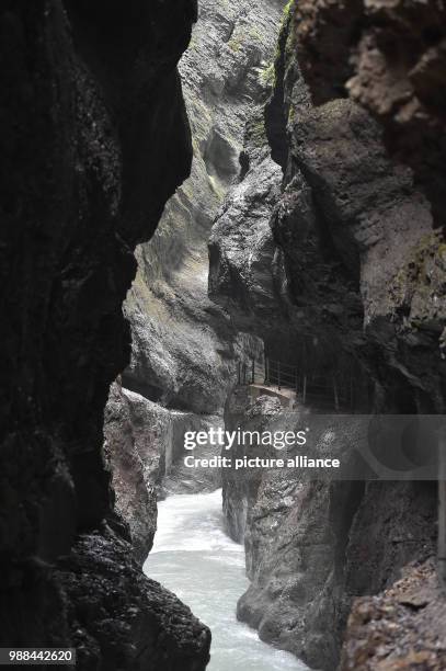 June 2018, Germany, Garmisch-Partenkirchen: The Partnach river flowing through the Partnachklamm. The tourist destination remains closed after severe...