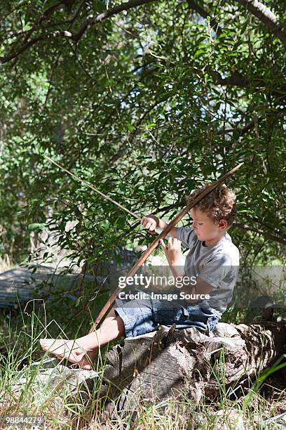 boy with bow and arrow - crossbow ストックフォトと画像