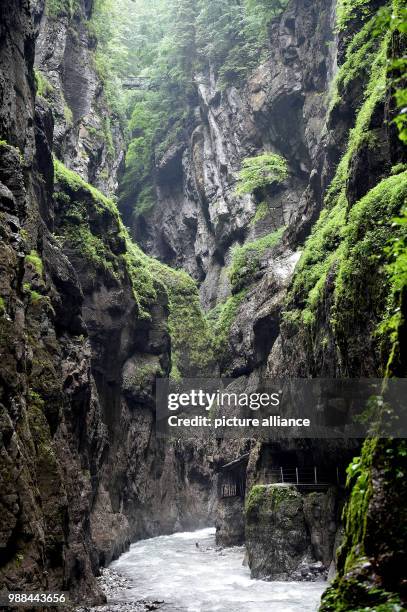 June 2018, Germany, Garmisch-Partenkirchen: The Partnach river flowing through the Partnachklamm. The tourist destination remains closed after severe...