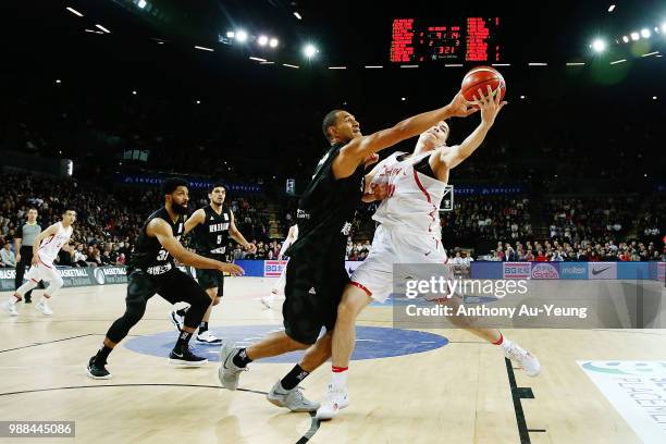 Mika Vukona of New Zealand competes against Abudushalamu Abudurexiti of China during the FIBA World Cup Qualifying match between the New Zealand Tall...