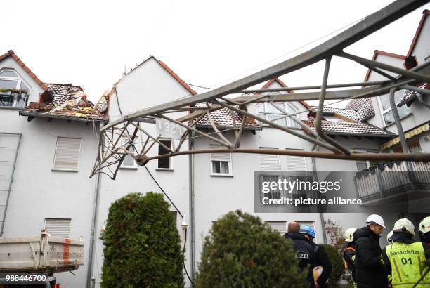 Construction crane falls onto apartment house, News Photo