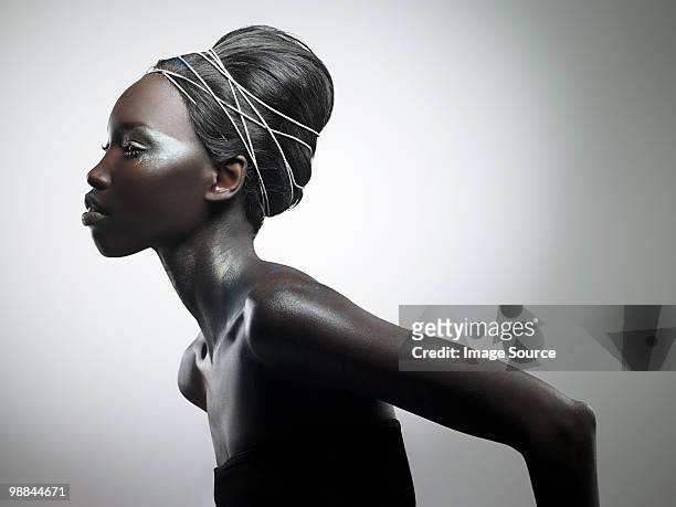 side view of woman with metallic make up - beautiful woman stock pictures, royalty-free photos & images