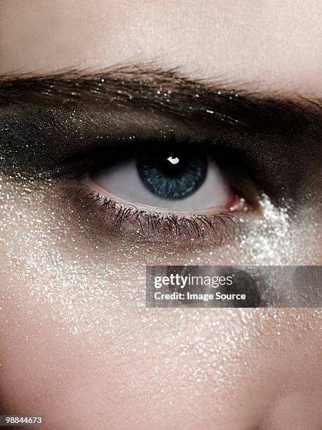 female eye with silver make up - silver make up stock pictures, royalty-free photos & images