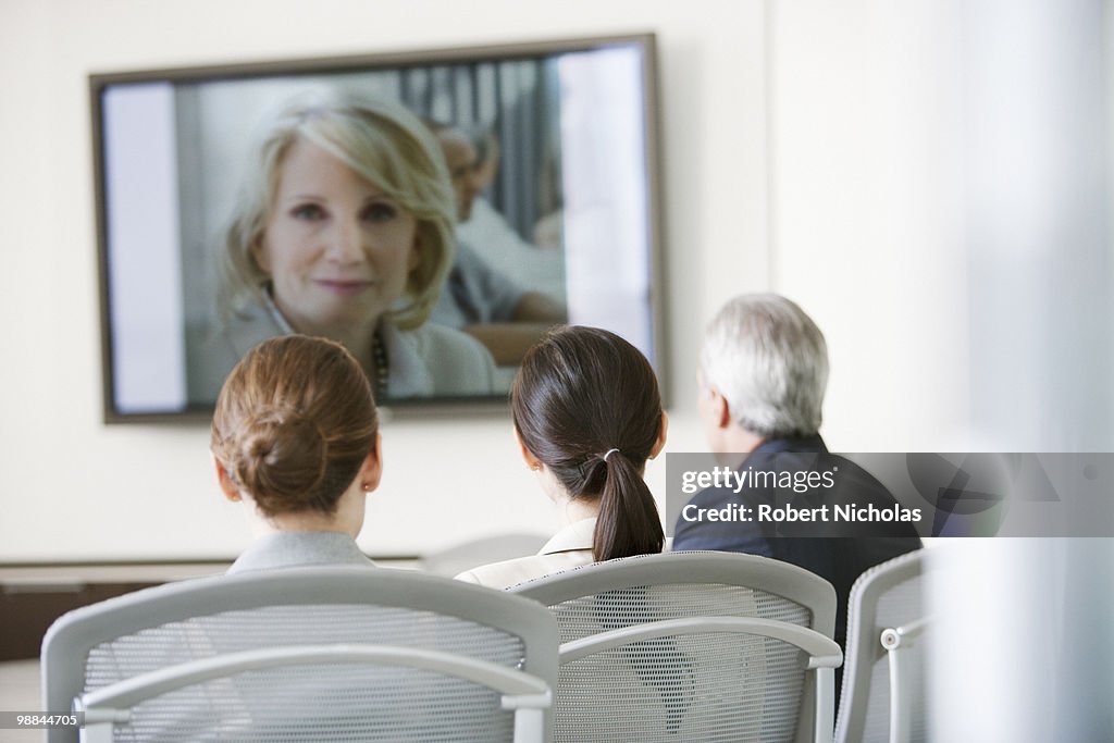 Business people having video conference in conference room