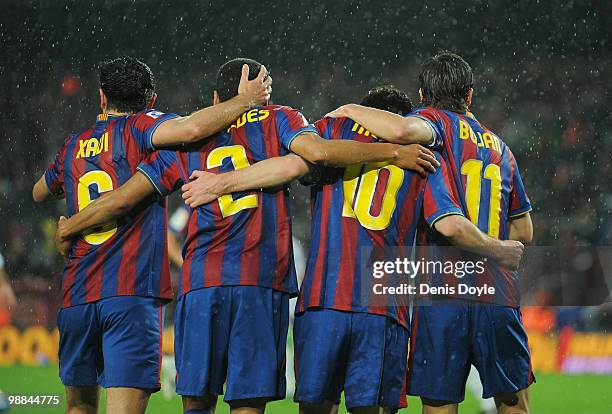 Barcelona's Xavi Hernendez, Daniel Alves Lionel Messi and Bojan Krkic celebrate after Messi scored Barcelon's first goal during the La Liga match...