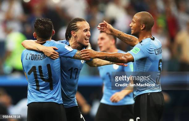 Diego Laxalt of Uruguay celebrates with team mates at full time during the 2018 FIFA World Cup Russia Round of 16 match between Uruguay and Portugal...