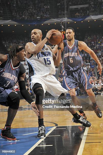 Vince Carter of the Orlando Magic drives the ball against Gerald Wallace of the Charlotte Bobcats in Game Two of the Eastern Conference Quarterfinals...