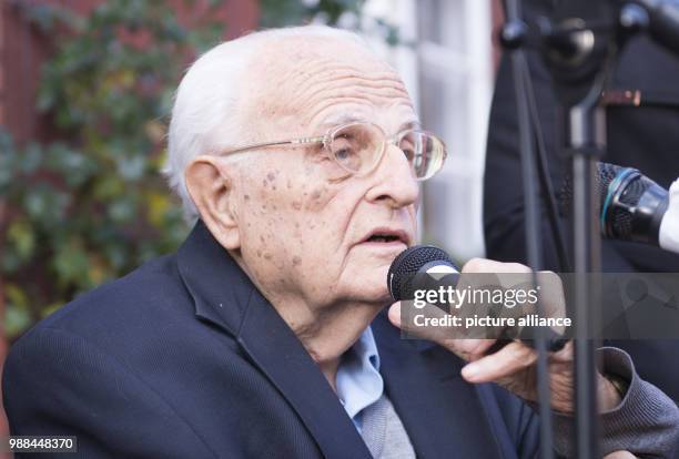 Karol Kubicki, son of Stanislaw Kubicki, who was imprisoned and killed in 1941 for resistance, speaks during the letting in of a 'Stolperstein' at...