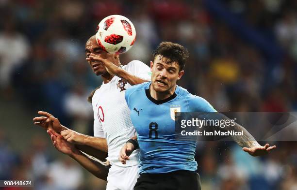 Ricardo Quaresma of Portugal vies with Nahitan Nandez of Uruguay during the 2018 FIFA World Cup Russia Round of 16 match between Uruguay and Portugal...