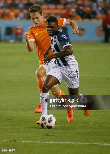 Monterrey midfielder Aviles Hurtado pushes the ball ahead of Houston Dynamo midfielder Todd Wharton during the BBVA Compass Dynamo Charities Cup...