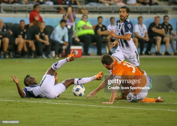 Monterrey midfielder Aviles Hurtado collides with Houston Dynamo midfielder Todd Wharton during the BBVA Compass Dynamo Charities Cup soccer match...