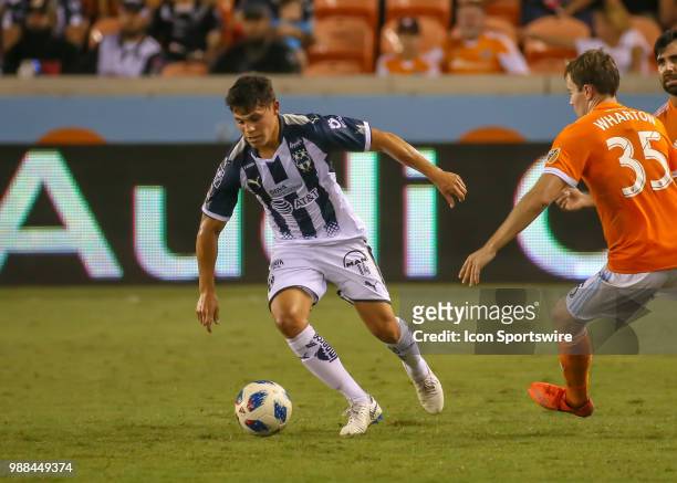 Monterrey mifielder Alfonso Gonzalez moves the ball away from Houston Dynamo midfielder Todd Wharton during the BBVA Compass Dynamo Charities Cup...