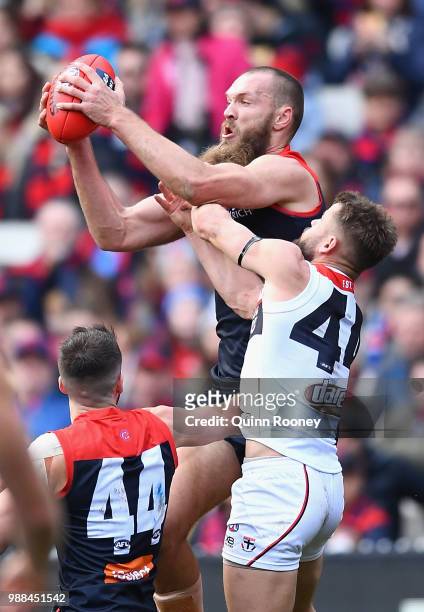 Max Gawn of the Demons marks infront of Maverick Weller of the Saints during the round 15 AFL match between the Melbourne Demons and the St Kilda...