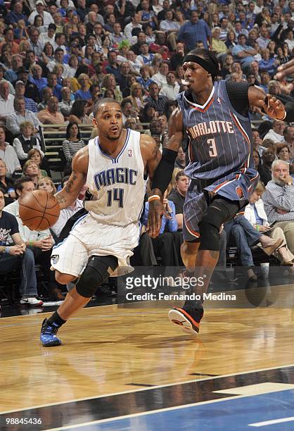 Jameer Nelson of the Orlando Magic drives the ball against Gerald Wallace of the Charlotte Bobcats in Game Two of the Eastern Conference...