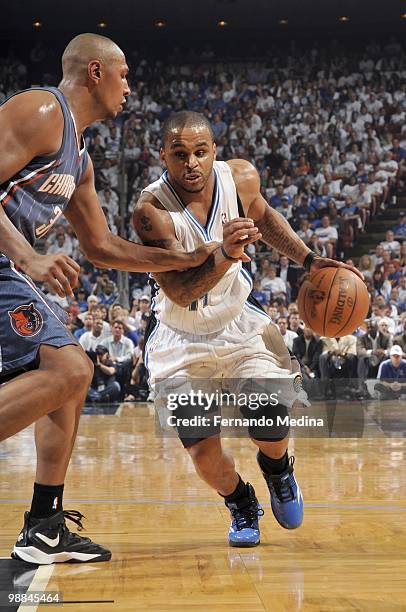 Jameer Nelson of the Orlando Magic drives the ball against Boris Diaw of the Charlotte Bobcats in Game Two of the Eastern Conference Quarterfinals...