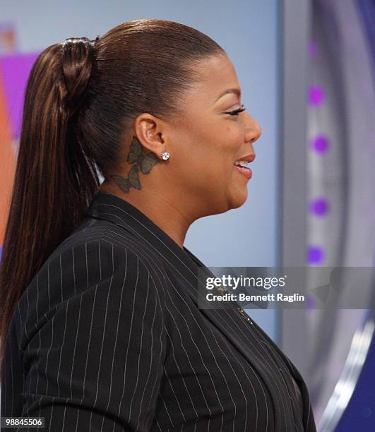 Actress Queen Latifah displays her new tattoo during a visit BET's "106 & Park" at BET Studios on May 3, 2010 in New York City.
