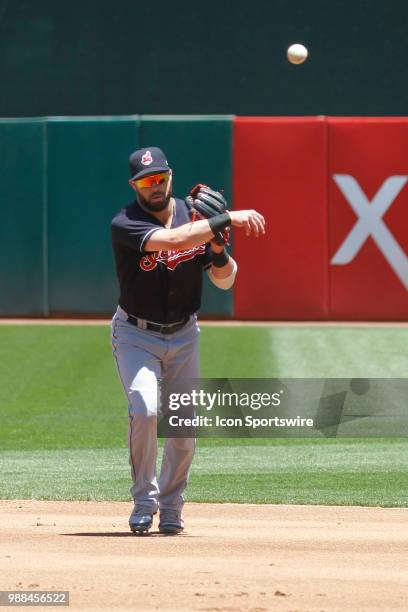 Cleveland 2B Jason Kipnis throws to first for an easy out in the MLB game on June 30, 2018 between the Indians and A's at Oakland-Alameda County...