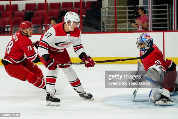 Carolina Hurricanes Mario Culina makes a save on a shot by Carolina Hurricanes Andrei Svechnikov during the Canes Prospect Game at the PNC Arena in...