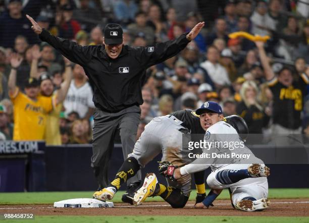 Gregory Polanco of the Pittsburgh Pirates slides into third base with a triple ahead of the tag of Christian Villanueva of the San Diego Padres...