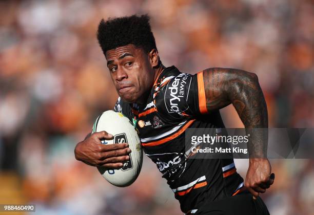 Kevin Naiqama of the Tigers makes a break during the round 16 NRL match between the Wests Tigers and the Gold Coast Titans at Leichhardt Oval on July...