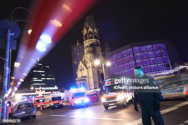 Emergency rescue teams and police forced are at work near the memorial church in Berlin, Germany, 19 December 2017. Anis Amri is responsible for...