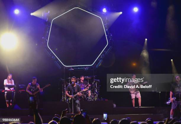 Rory Carey, Marley D. Williams, Eric Rachmany, Wesley Finley, Kyle Ahern, Zach Meyerowitz of Rebelution perform live at Veterans United Home Loans...