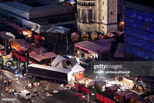 Trail of destruction is left behind at the Christmas market at the Berlin Breitscheidplatz in Berlin, Germany, 20 December 2016. Anis Amri is...