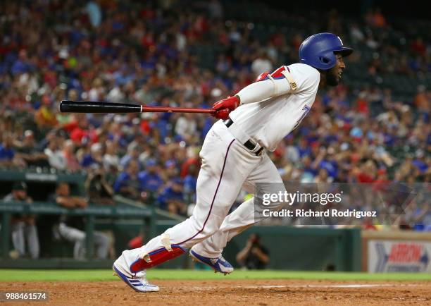 Jurickson Profar of the Texas Rangers heads to first after hitting a two-run double in the eighth inning against the Chicago White Sox at Globe Life...