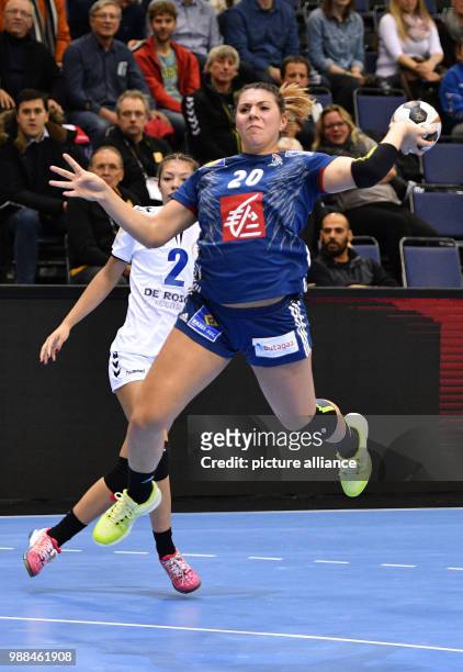 France's Laura Flippes throws the ball at the opposing team's goal during the World Women's Handball Championship match between France and Paraguay...