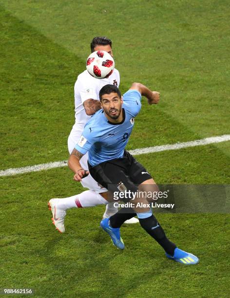 Luis Suarez of Uruguay battles for possession with Jose Fonte of Portugal during the 2018 FIFA World Cup Russia Round of 16 match between 1st Group A...