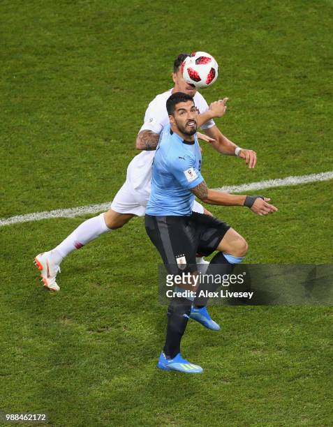 Luis Suarez of Uruguay battles for possession with Jose Fonte of Portugal during the 2018 FIFA World Cup Russia Round of 16 match between 1st Group A...